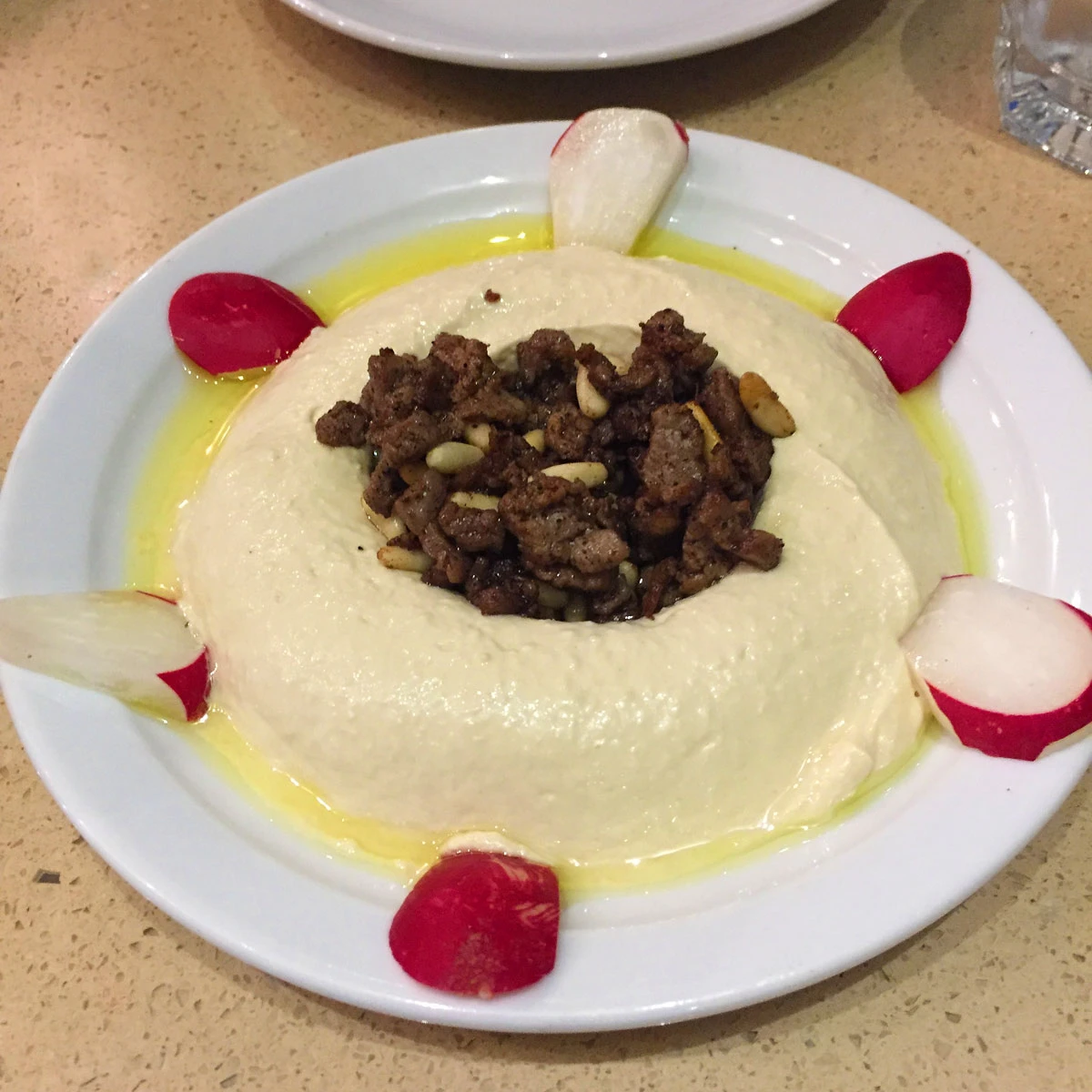 Hummus with pine nuts and ground beef