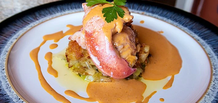 Butter poached lobster with leeks and a lobster sauce