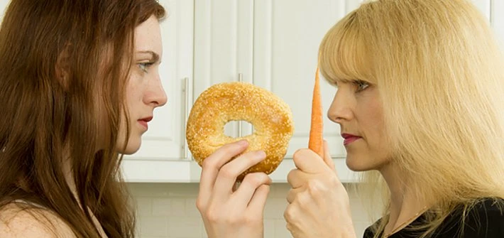 Women disagreeing over food