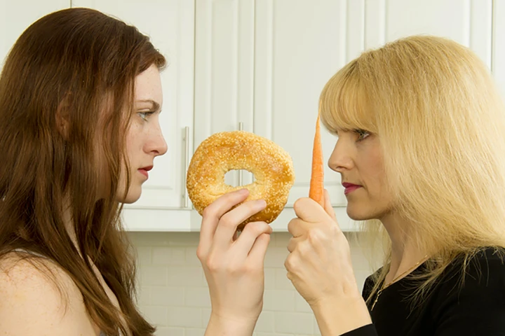 Women disagreeing over food