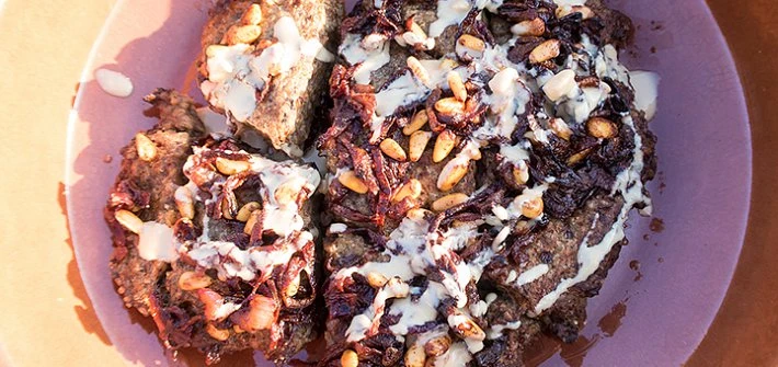 Baked lamb kibbeh with onions, pine nuts and tahini
