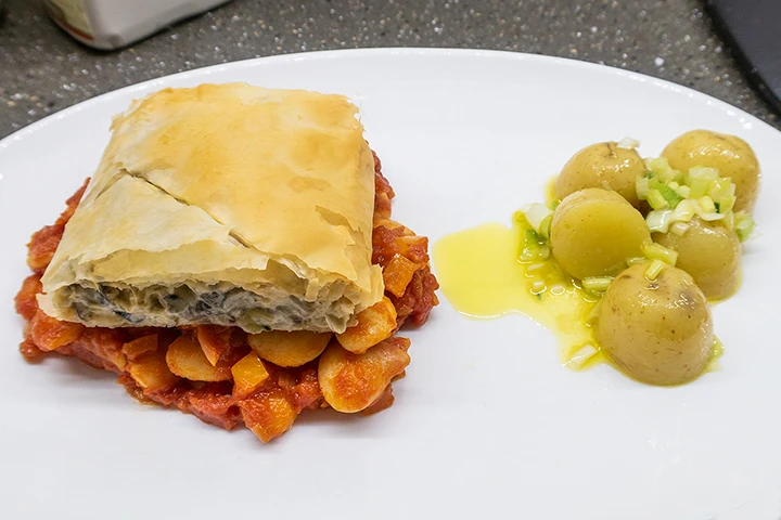 Mushroom strudel with butter beans in tomato sauce