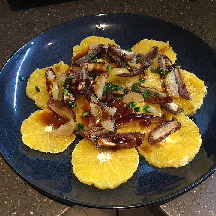 Orange salad with medjool dates, green chilli and pomegranate molasses