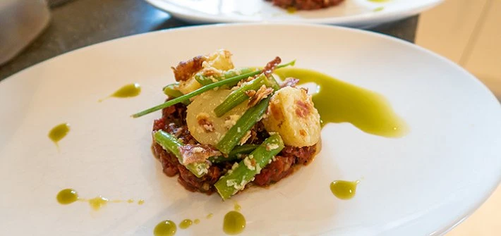 Potato, pancetta and goat's cheese salad with tomato tartare