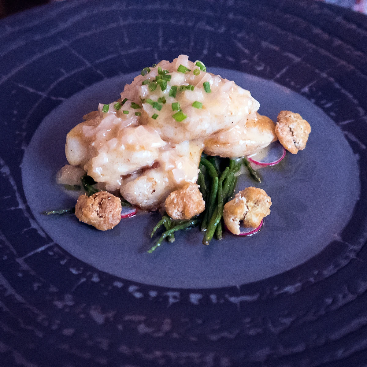 Seared cod cheeks with cockle popcorn
