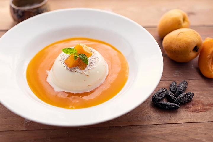 Tonka bean panna cotta with apricot coulis